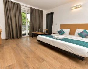 spacious delux king room with outdoor terrace at Hotel Luxury Stay.