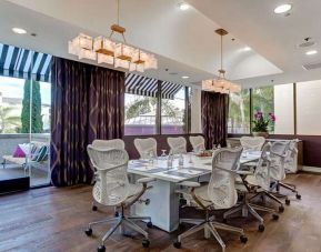 Bright meeting room with windows at Avenue Of The Arts Hotel.