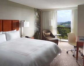 Bright king bedroom with window and workstation at Atlanta Marriott Northwest At Galleria.