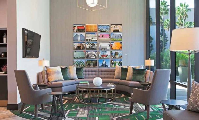 Lobby and coworking lounge at H Hotel Los Angeles, Curio Collection By Hilton.
