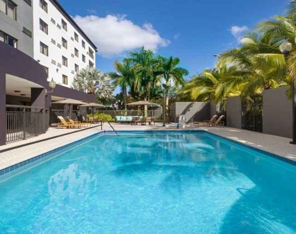 Refreshing outdoor pool at Courtyard Miami Dolphin Mall.