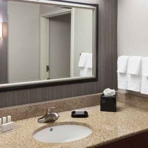 Guest bathroom with shower at Courtyard Miami Dolphin Mall.