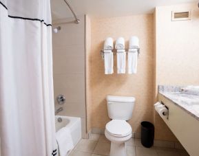 Clean and spacious guest bathroom with shower and bath combo at Lake Tahoe Resort Hotel.