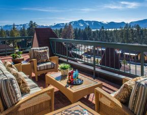 Stunning outdoor balcony and deck area with mountain views at Lake Tahoe Resort Hotel.