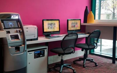 Well equipped business center with PC, internet, and printer at Courtyard By Marriott New York JFK Airport.