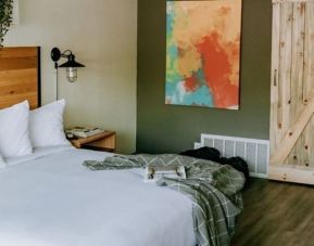 Relaxing vibes in this king bedroom at SCP Hotel Colorado Springs.