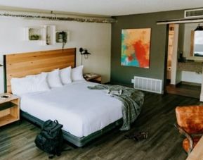 Spacious delux king room with work desk at SCP Hotel Colorado Springs.