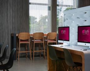 Dedicated business center with PC, internet, and workspace at Aloft Miami Aventura.