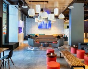 Comfortable lounge and coworking space at Aloft Miami Aventura.