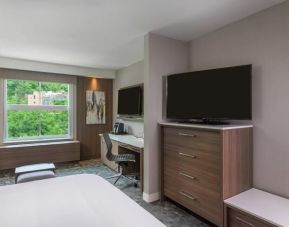 Delux king room with TV and work station at Courtyard Edgewater NYC.