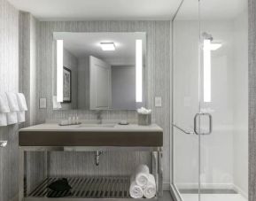 Spacious guest bathroom with shower at Courtyard Edgewater NYC.