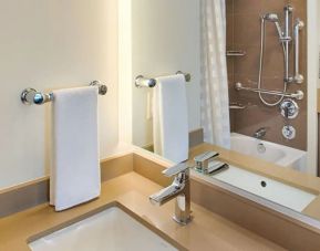 Guest bathroom with shower at Hyatt House Seattle Downtown.