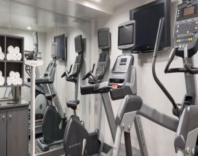 Well equipped fitness center with treadmills at Holiday Inn Wall Street.