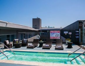 Stunning outdoor poolwith seating area at Porto Vista Hotel.