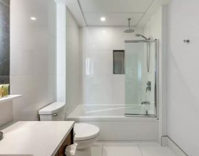 Private guest bathroom with shower and bath at Hotel Royal William, an Ascend Collection hotel.