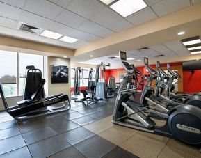 Radisson Hotel JFK Airport’s fitness room, equipped with assortment of exercise machines.