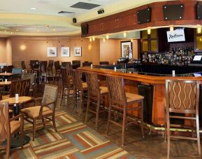 The hotel’s lounge bar, with tall bar chairs (and smaller tables and chairs).