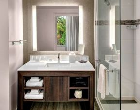 Private guest bathroom with shower at Residence Inn Miami Beach Surfside.
