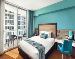 King bedroom with work station and balcony at Marenas Beach Resort.