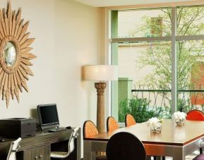 Business center with PC, internet, and printer, and work space at Hotel Indigo New Orleans Garden District.