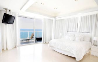 Luxurious king suite with ocean view at Ocean Manor Beach Resort.