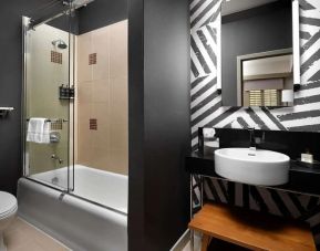 Guest bathroom with shower at Villa Florence Hotel.