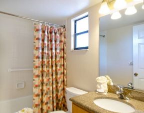 Private guest bathroom with shower at Park Shore Resort.