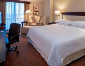 Sheraton Houston Brookhollow Hotel guest room with double bed and a workspace desk and chair.