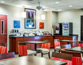 The Comfort Suites Lombard – Addison’s breakfast area has small tables and a hard floor.