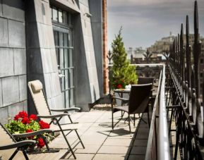 Many of the rooms in Hotel Gault have balconies with chairs and tables.