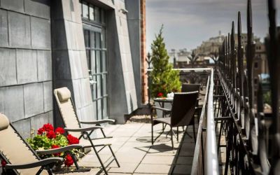 Many of the rooms in Hotel Gault have balconies with chairs and tables.