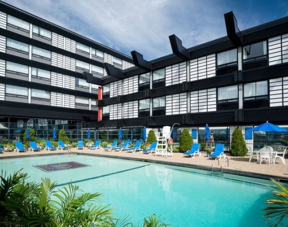 Stunning outdoor pool with sunbeds at Hotel Ruby Foo's.