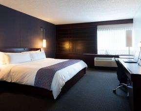 Spacious delux king room with business desk at Hotel Ruby Foo's.