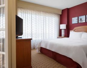 Spacious king suite with TV at Anaheim Marriott Suites.