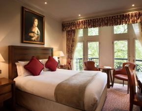 The Royal Horseguards Hotel’s garden view double room, with large windows for a verdant view.