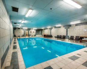 The hotel’s indoor pool has chairs and towels close at hand for swimmers.