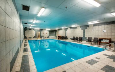 The hotel’s indoor pool has chairs and towels close at hand for swimmers.