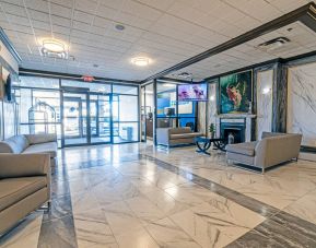 The Quality Inn Halifax Airport’s lobby has numerous comfy sofas, plus a widescreen TV and art on the walls.