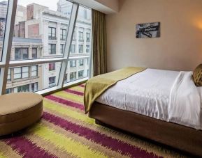 Floor-to-ceiling windows in a double bedroom at the Best Western Premier Herald Square.