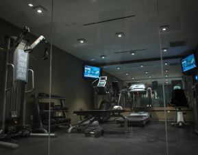 The hotel’s exercise room, with stacked weights and assorted fitness machines.