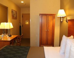 Guest room at the Econo Lodge Times Square, with large bed, desk for working, and wardrobe.