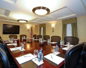A meeting room in the San Carlos Hotel, with long table and space for a dozen attendees.