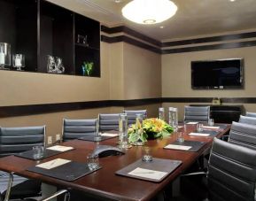 A boardroom-style meeting room within the Hilton Fashion District.