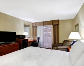Guest room in Holiday Inn Laval Montreal, featuring workspace desk and chair.