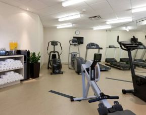The hotel fitness center is equipped with a range of different exercise machinery.