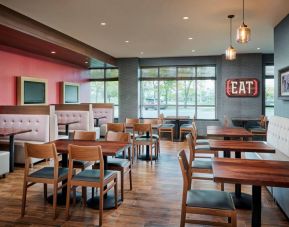 Burger Theory Restaurant and Bar is the on-site dining venue, with tables for four or two diners.