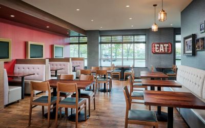 Burger Theory Restaurant and Bar is the on-site dining venue, with tables for four or two diners.