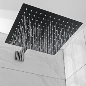 Guest bathroom with shower at Hotel Opus Bronx.