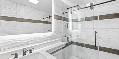 Guest bathroom with shower at Hotel Opus Bronx.