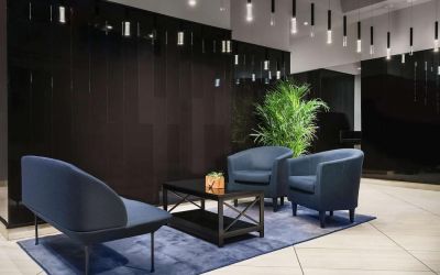 The hotel’s lobby, with comfortable chairs and sofa, plus coffee table.